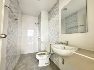 Modern bathroom with shower, toilet, and sink