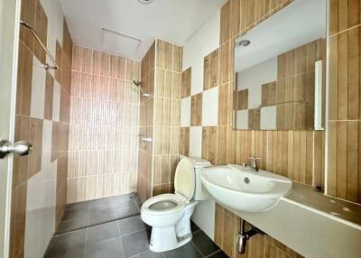 modern bathroom with wooden tile accents