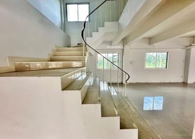 Spacious living area with staircase