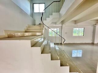 Spacious living area with staircase