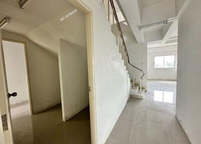 hallway with staircase and rooms