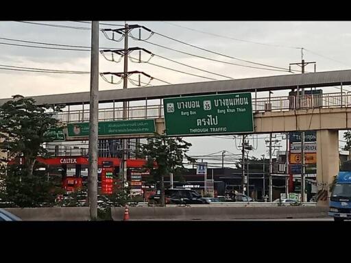 Street view with overpass and traffic signs