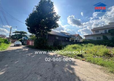 Street view with visible houses and greenery