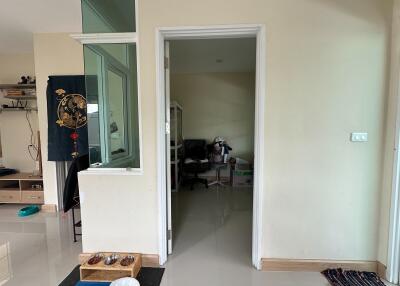 Entrance to a room with partial view of adjacent areas