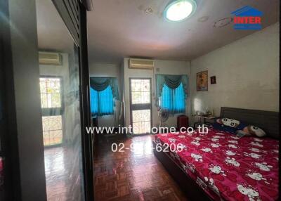 Bedroom with double bed, mirrored wardrobe and balcony access