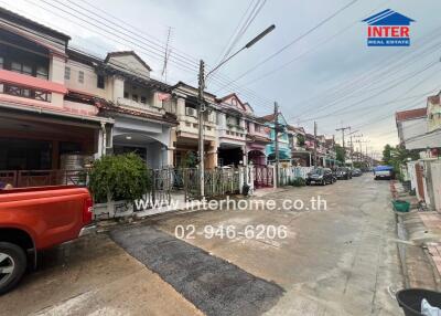 Street view of a neighborhood with various houses