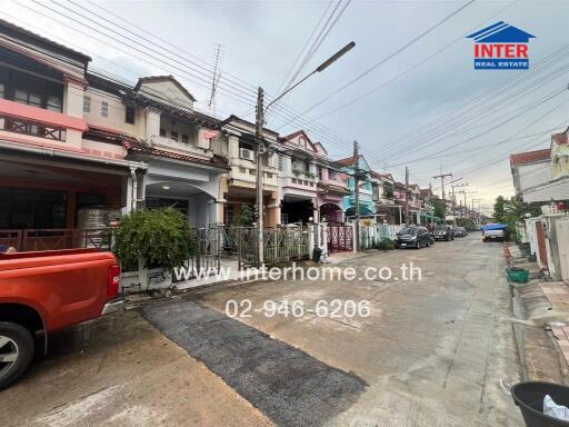 Street view of a neighborhood with various houses