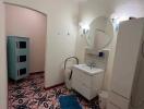 Well-lit bathroom with a mirror and vanity