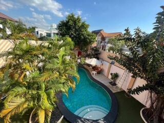 Outdoor area with swimming pool and plants