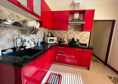 modern kitchen with red cabinetry