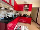 modern kitchen with red cabinetry