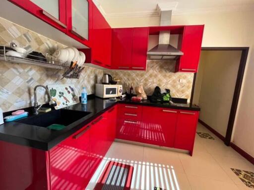 modern kitchen with red cabinetry