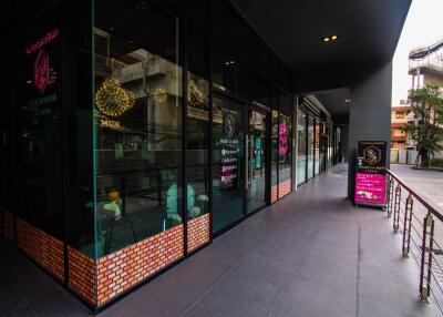 Exterior of a commercial building with glass windows and brick accents