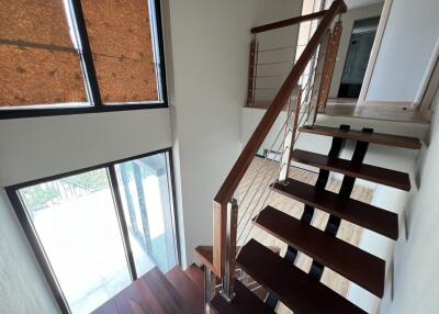 Modern interior staircase with wood and metal railing