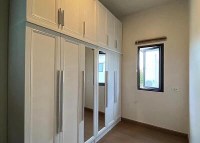 Bedroom with wardrobes and window