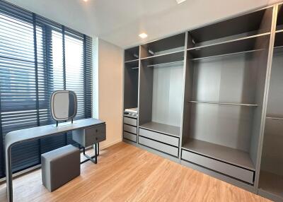 Bedroom with modern furniture and wardrobe