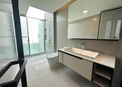 Modern bathroom with large mirror and glass shower