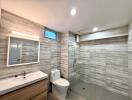 Modern bathroom with wood-grain tiles and glass shower