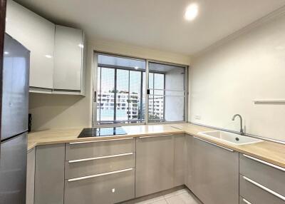 Modern kitchen with appliances and large window