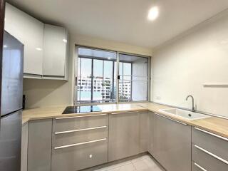 Modern kitchen with appliances and large window