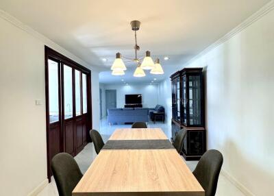 Modern dining room with wooden table and black chairs