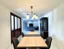 Modern dining room with wooden table and black chairs