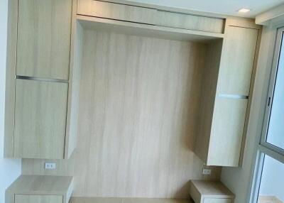 Built-in wardrobes and window in bedroom