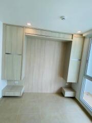 Built-in wardrobes and window in bedroom