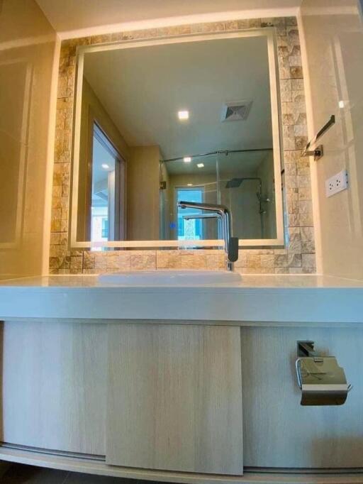 Modern bathroom with large mirror and sink