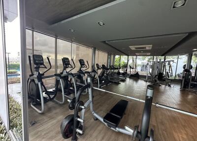 Modern fitness room with gym equipment