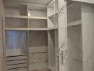 Modern walk-in closet with marble design