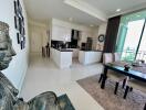 Modern kitchen and dining area with statue decoration