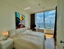 Modern bedroom with large window and city view