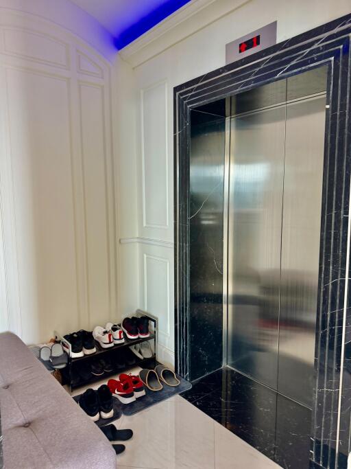 Elevator area with shoe rack