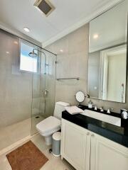 Modern bathroom with glass shower and vanity