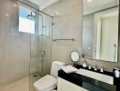 Modern bathroom with glass shower and vanity