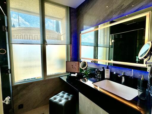 Modern bathroom with large windows and stylish vanity