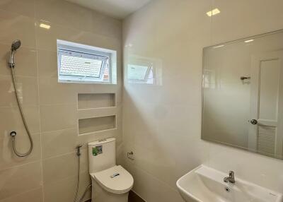 modern bathroom with shower, toilet, and sink