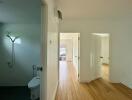 Bright, spacious hallway with access to a bathroom and two rooms