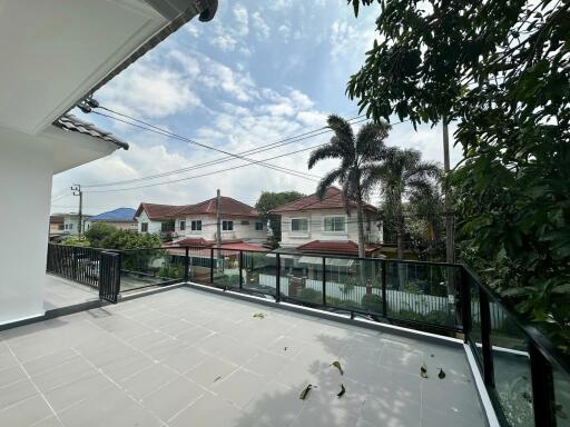 Spacious balcony with a view of neighbor houses