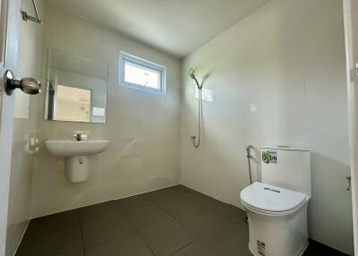 Modern bathroom with wall-mounted sink and toilet