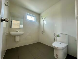 Modern bathroom with wall-mounted sink and toilet