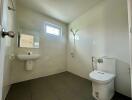 Modern bathroom with wall-mounted sink and toilet