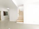 Modern white staircase in a bright home