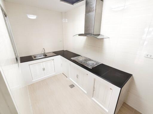 Modern kitchen with a built-in stove and sink