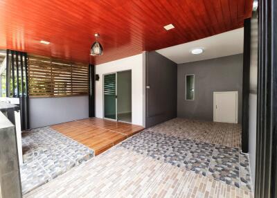 Open area with wooden and tiled flooring