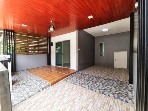 Open area with wooden and tiled flooring