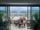 Balcony with a scenic view of the city and mountains