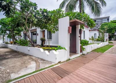 Exterior view of a modern residential building with garden