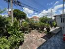 A beautiful garden area with potted plants and a pathway